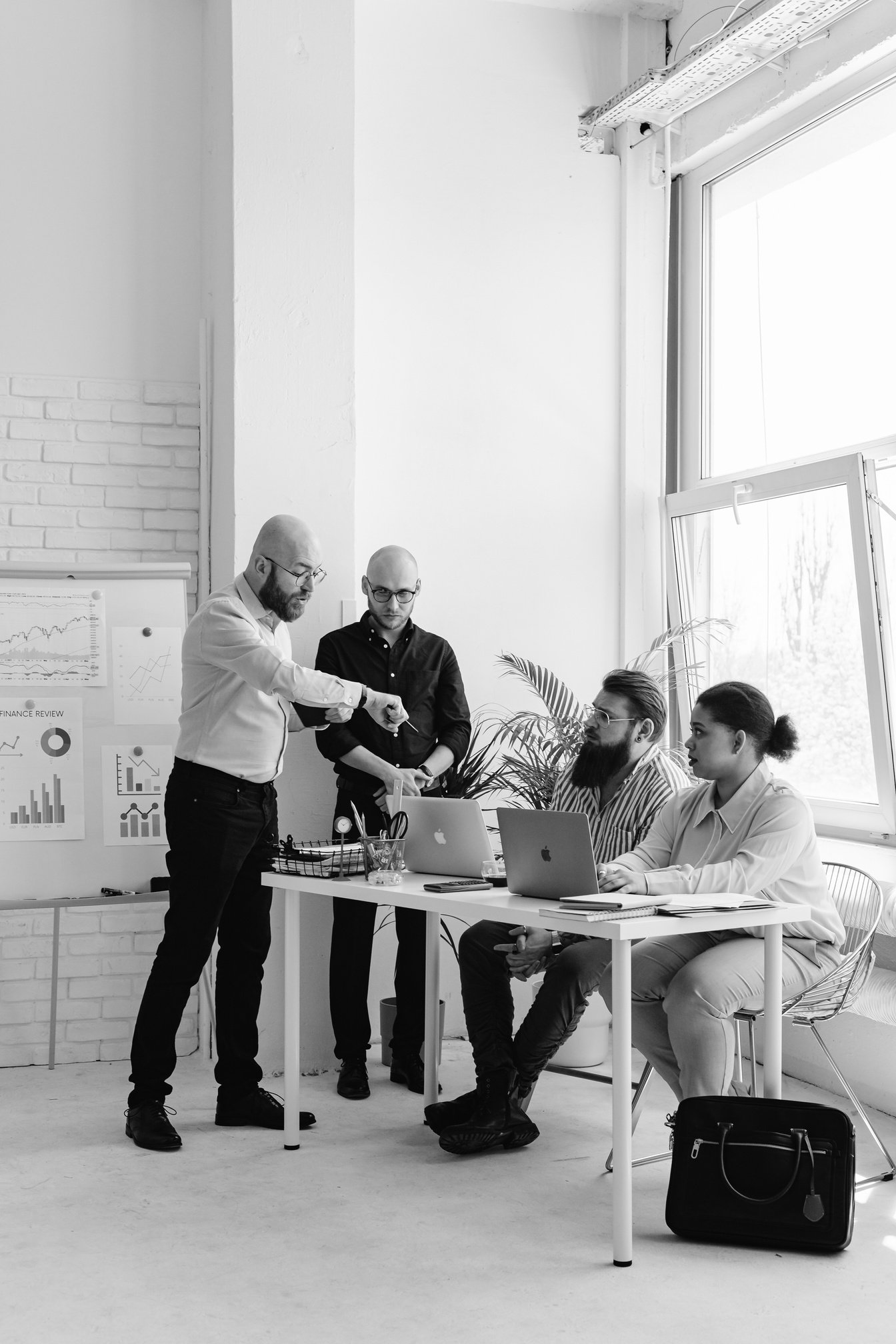 A consulting team reviewing organisational data together